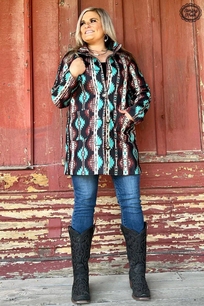 Ready to take your style up a notch? Look no further than the Durango Kreek Jacket! This eye-catching Aztec-patterned jacket features vibrant turquoise, marron, and cream colors and is finished with authentic Buffalo-nickel buttons. Put some spice in your wardrobe!  93% POLYESTER 7% SPANDEX