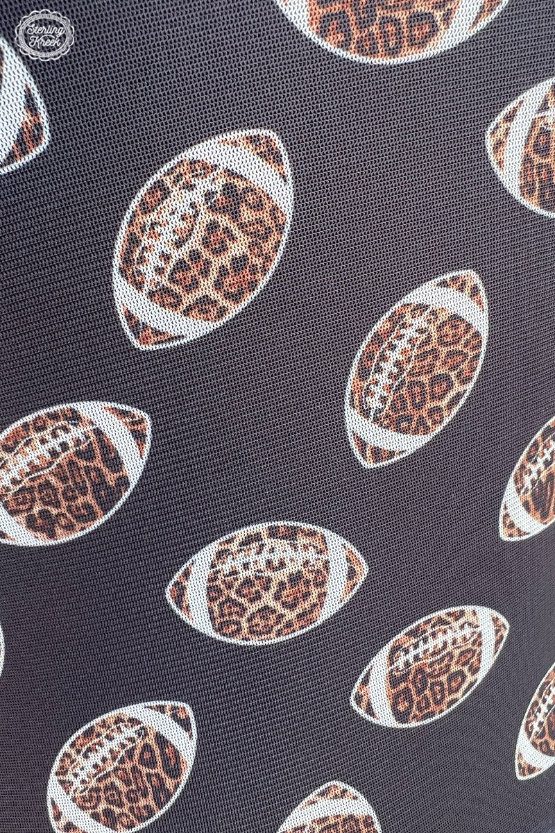 ITS FOOTBALL SEASON!!! Score a touchdown at the next game with this totally wild top! The Girls of Fall Top features cheetah footballs. With a black mesh fabric this is sure to be your go-to when cheering for the team! Let's get ready to ruuuumble! 🏈🐆  96% POLYESTER 4% SPANDEX