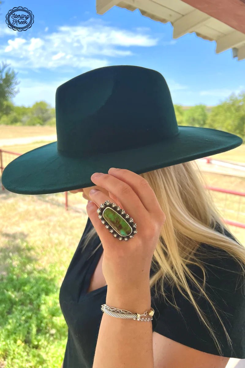 The perfect accessory for the cool and confident, The JANE Hat is here to make waves. This dark green felt hat will have you looking dapper and fearless. You'll be the envy of the room when you make your entrance wearing The JANE!