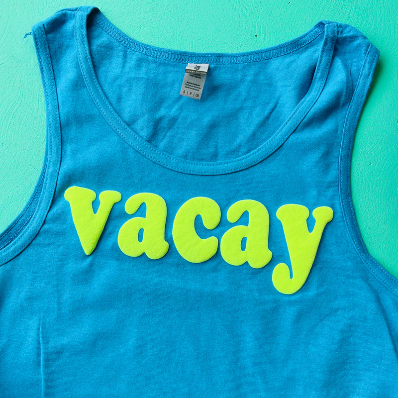 Take your style game up a notch with our Vacay Tank Top! Perfect for a summer day out, this turquoise tank is printed with the dreamy phrase, VACAY. Enjoy its raised 3D effect for a unique look, plus the premium cotton will keep you comfortable all day long. Ready for some fun under the sun? Get to VACAY-ING' in this tank!  100% Cotton