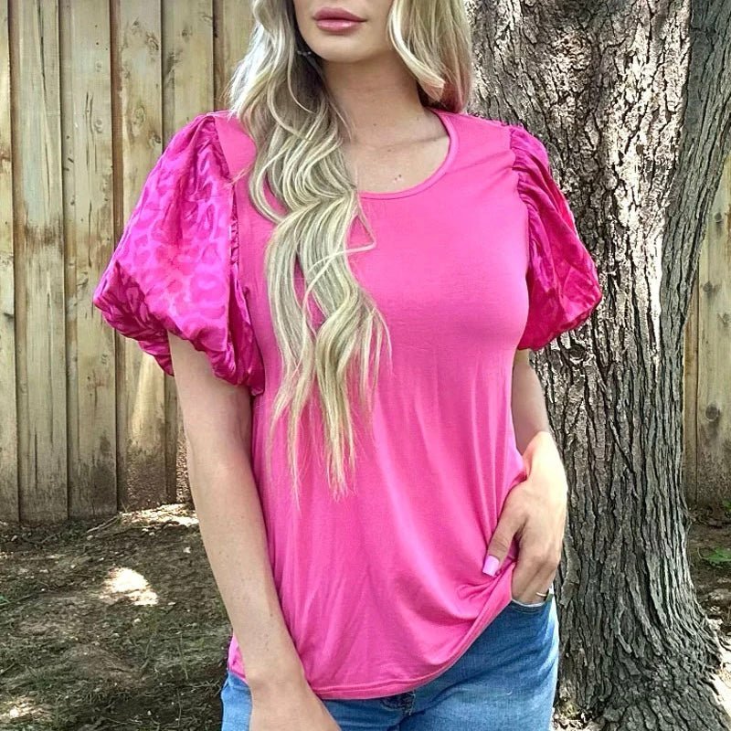 Let your wild side out with our LOUISIANA WOMAN TOP! With pink cheetah bubble short sleeves, you'll stand out in any room and turn heads with a hot 'n' spicy style! Y'all are gonna love it!