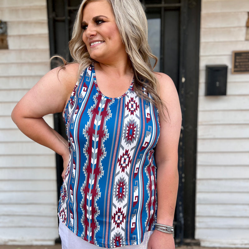 This STREETS OF LAREDO Tank is sure to be the centerpiece of your wardrobe! With a vibrant red, cream and blue Aztec print, you'll be stepping out in style and turning heads. Perfect for any occasion that calls for a little extra flare, this eye-catching tank is guaranteed to be the talk of the town!  50% POLYESTER 45% COTTON 5% SPANDEX
