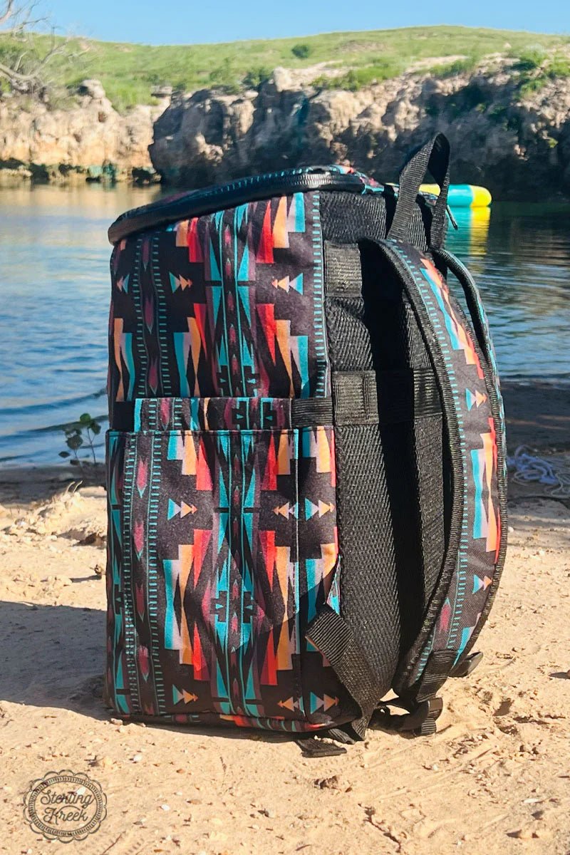 Climb to summit style with the PIKES PEAK COOLER BACKPACK! This 'cool' bag features a black base with an eye-catching orange and turquoise Aztec print - a look so fresh it'll inspire you to reach new heights! Its insulated lining will keep your drinks cold, so you can make the most of any adventure. Don't delay - rise and shine!  15X11X7.5