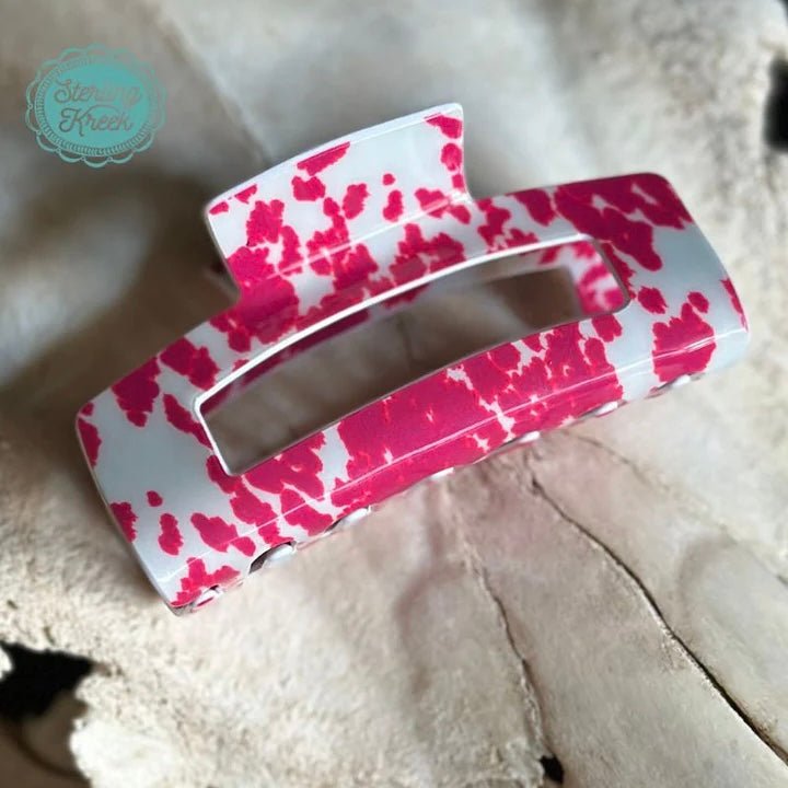 Add some moo-d to your look with this Strawberry Moo Hair Clip! The neutral pink cow print brings bovine style to any outfit. Plus, it grips hair tightly and comfortably, so you can keep looking cute all day long!  L 4 X W 1.5 X H 2