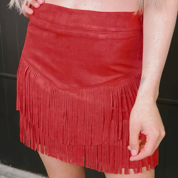 Be ready to hit the dancefloor (or, like, the grocery store) in this Fort Worth Fringe Skirt! This sassy little number is made of red fringe that swirls and twirls every time you move. Don't be shy — unleash your inner wild thing!  This skirt has sewn is shorts underneath and a zipper on the side :) These skirts are so soft and comfortable!      Shell: 92% POLYESTER 8% SPANDEX  Lining: 100% POLYESTER  Measurements are with the skirt laid flat 