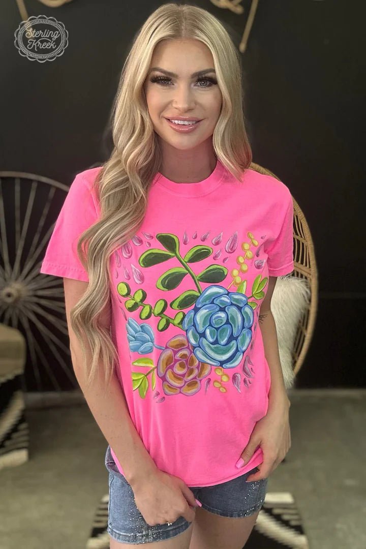 Make a bold statement in the Feelin' Floral tee! With its bright neon pink shade and floral design, this t-shirt will have you standing out from the crowd and feeling like a flower queen. Get ready to blossom! 🌸