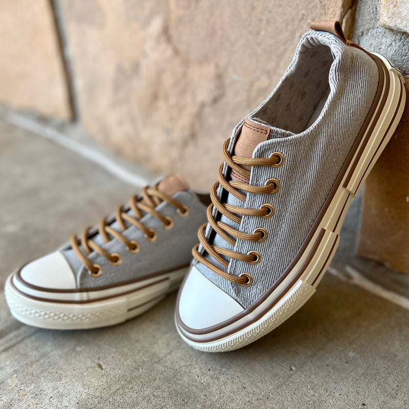 These sneakers are not only cute and stylish, but the comfy as all get out! The super cushioned foot bed offers optimal comfort. Ideal for everyday wear. The rubber sole ensures stability with every step. The upper shoe is a grey color and is a canvas like material. 