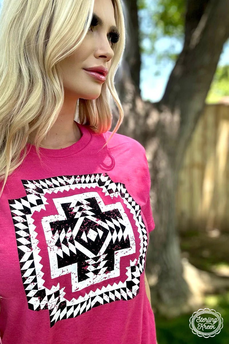 Be the newest trendsetter in the hood with this eye-catching 'New Chick On The Block' Tee! Featuring a vibrant pink color with a bold black and white Aztec design in the middle, it'll help you stand out in style. (No extra shopping required - it'll look good with anything!)