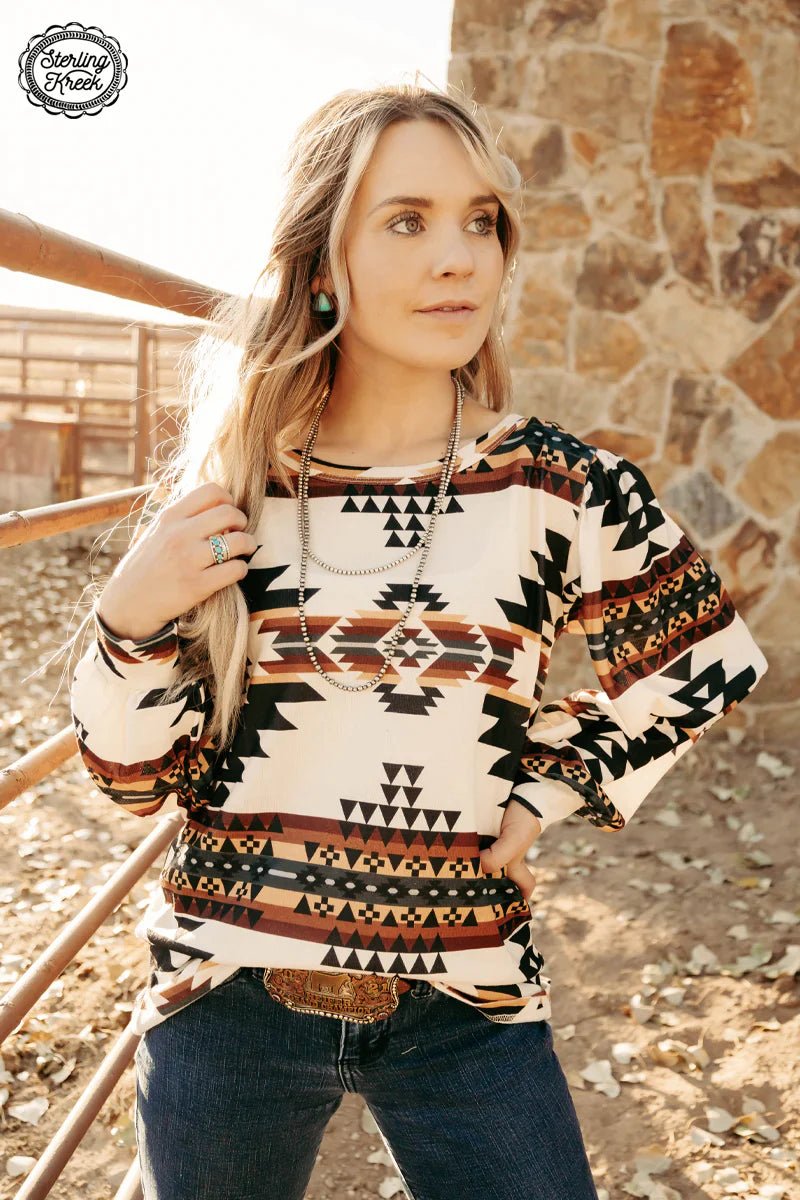 Be bold in this cream colored knit top, made with a subtle western aztec print. An easy choice for any stylish wardrobe, this unique and eye-catching top will be sure to turn heads!  Model is wearing an XS and is 5'2"  100% polyester