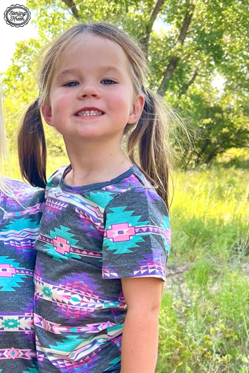 Be the life of the party in this Kids Mini Aztec Horizon Top! Eye-catching Aztec patterns in turquoise, purple, pink, and vintage black make sure your style won't be missed. Perfect for outdoor gatherings that call for a little sophisticated flair! 🤩   Mommy & Me Top...... Mom top can be ordered separate in the Tops Collection!!   