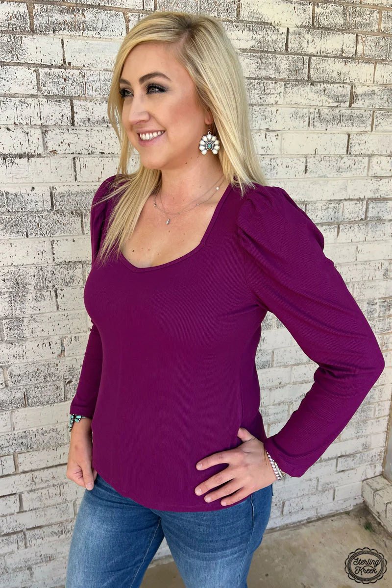 This Something Classy Plum Top is your ticket to party-perfect style! The ribbed fabric and bubble sleeve design bring a hint of retro flair, while the plum color will have you feeling purply-good no matter the occasion. Get ready to cut a rug in this classic-meets-modern piece!  92% Rayon 8% Spandex 