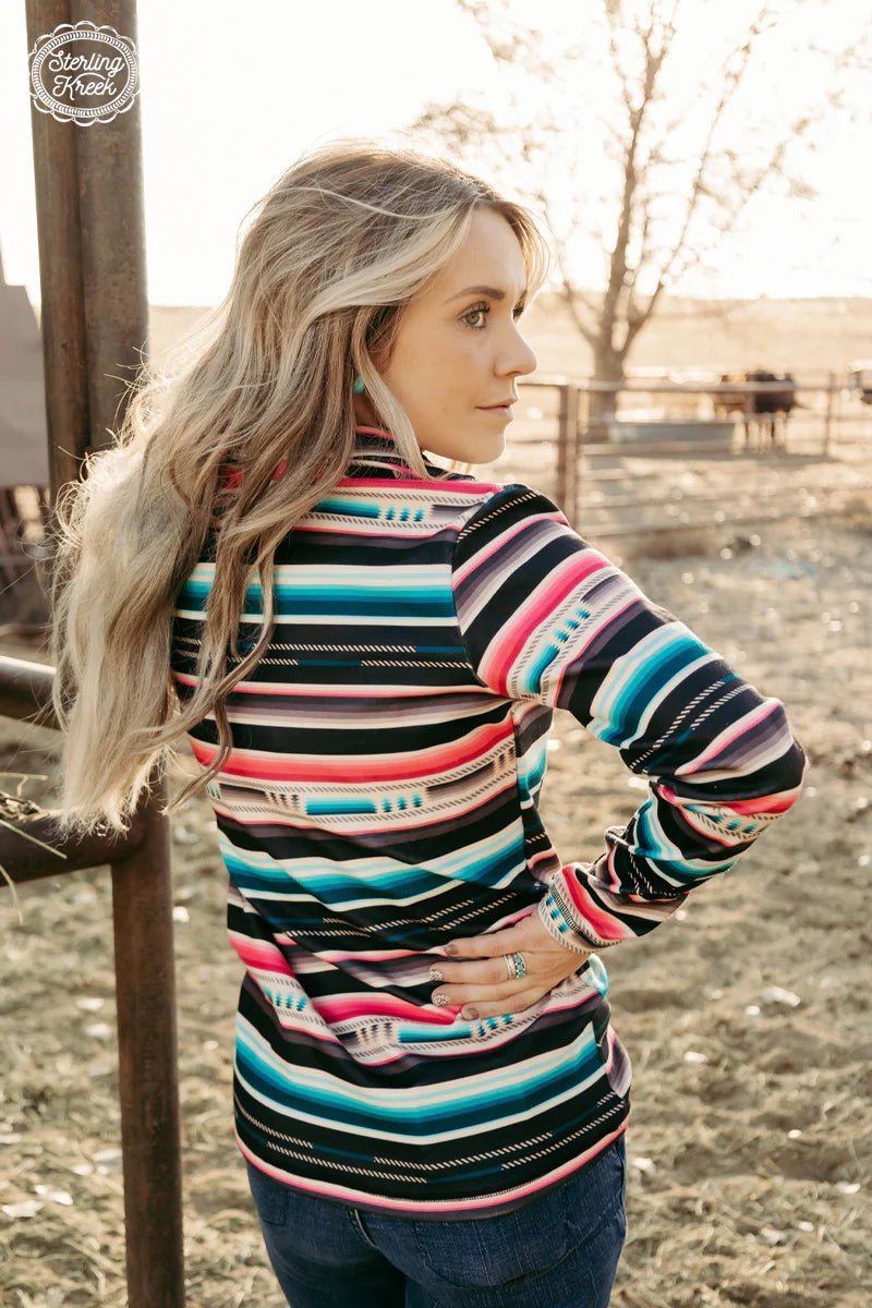 Look epic and feel cozy in this "Desert Dreams" Pullover featuring a trendy serape print. Stay warm without compromising on style! Perfect for a cool night out with friends or a night in on the couch. (Or both!) Let your style "siesta" with this one-of-a-kind pullover!  32% COTTON 56% RAYON 12% SPANDEX  Riding Fit-- NO pockets!