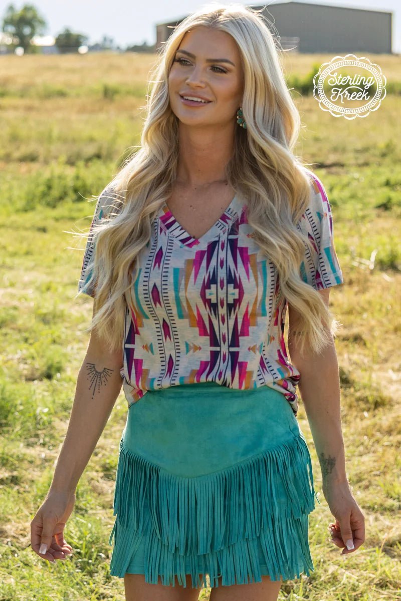 This top is the wild party animal you'll always be down for - double the fun with it's reversible v-neck, featuring a fierce turquoise leopard one side and a colorful aztec pattern on the other! We Go Together - like mac & cheese! 🧀  50% Polyester, 45% Cotton, 5% Spandex