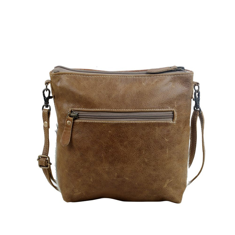 Brown leather bag. Tooled leather bag. Hair on hide. Leather bag. Cowhide. Western style. Small business. Gussied Up Online. Woman owned business.