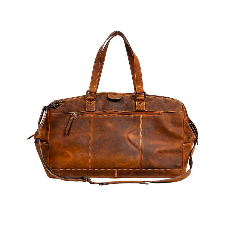 GENUINE LEATHER DUFFLE BAG. GENDER NEUTRAL LUGGAGE. LEATHER LUGGAGE. MYRA BAG. BOUTIQUE. SMALL BUSINESS. WOMAN OWNED. 