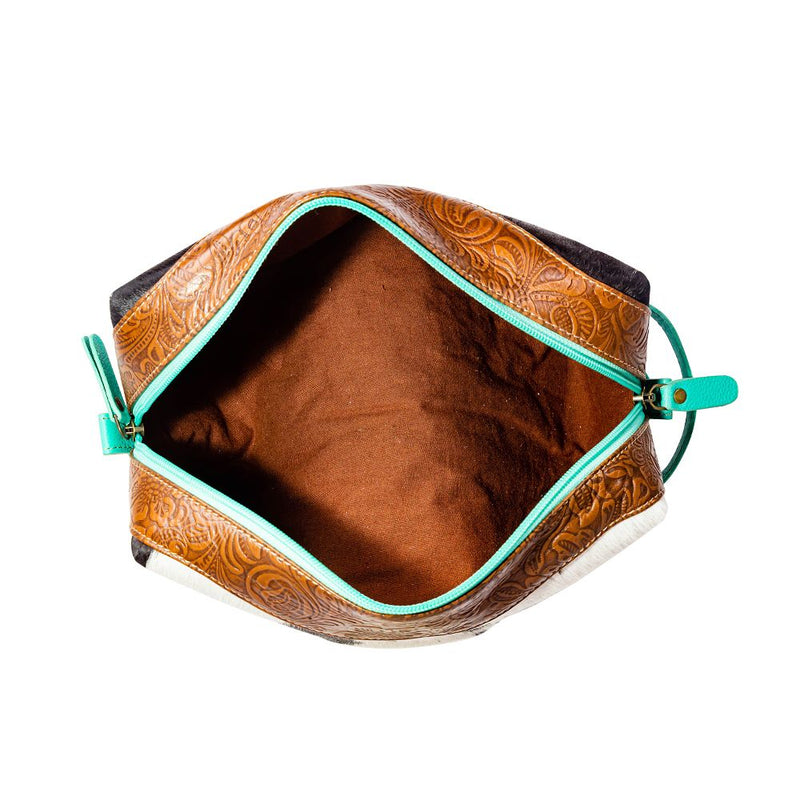 Turquoise leather make up case. Tooled leather. Hair on hide. Cowhide. Cosmetic case. Western Style. Boutique. Small business. Woman owned business. 