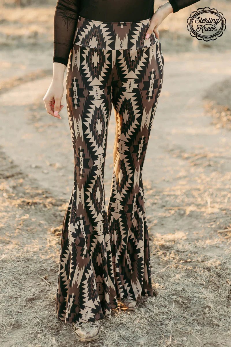 Sterling Kreek Bell Bottoms. Bell Bottoms. Aztec pants. High waisted pants. Aztec Bell bottoms. Stretchy pants. Comfortable pants. Western style. Women's western wear. Women's aztec pants. Women's western boutique. Women's western wear. Online boutique. Small business. Woman owned. 