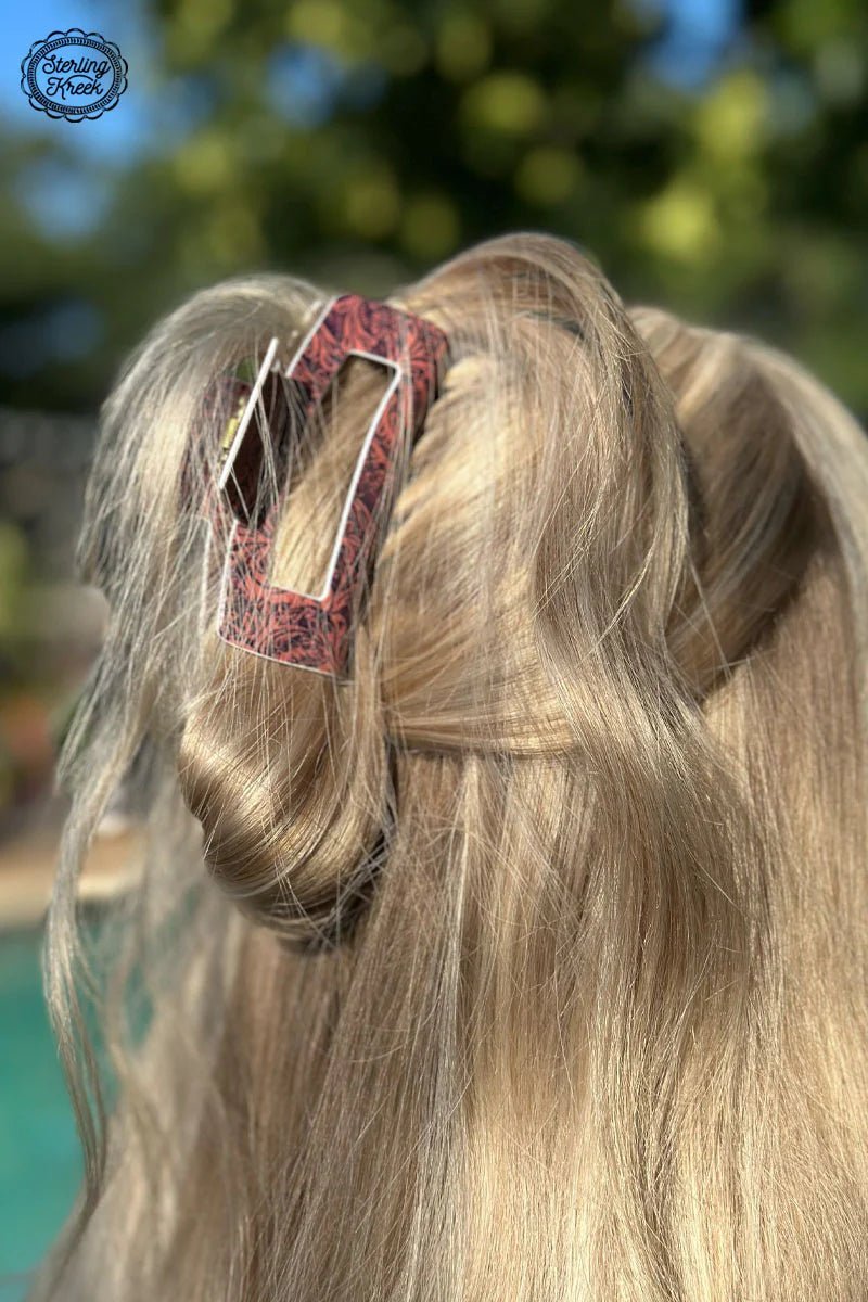 Upgrade your everyday 'do with our Tooled Babe Hair Clip! This eye-catching tooled print, this clip adds a subtle touch of style that'll turn heads - no matter your hair type or color. And with its sturdy grip, this clip will keep your hair in place all day long. Be the babe of any gathering with this stylish clip!  L 4 X W 1.5 X H 2