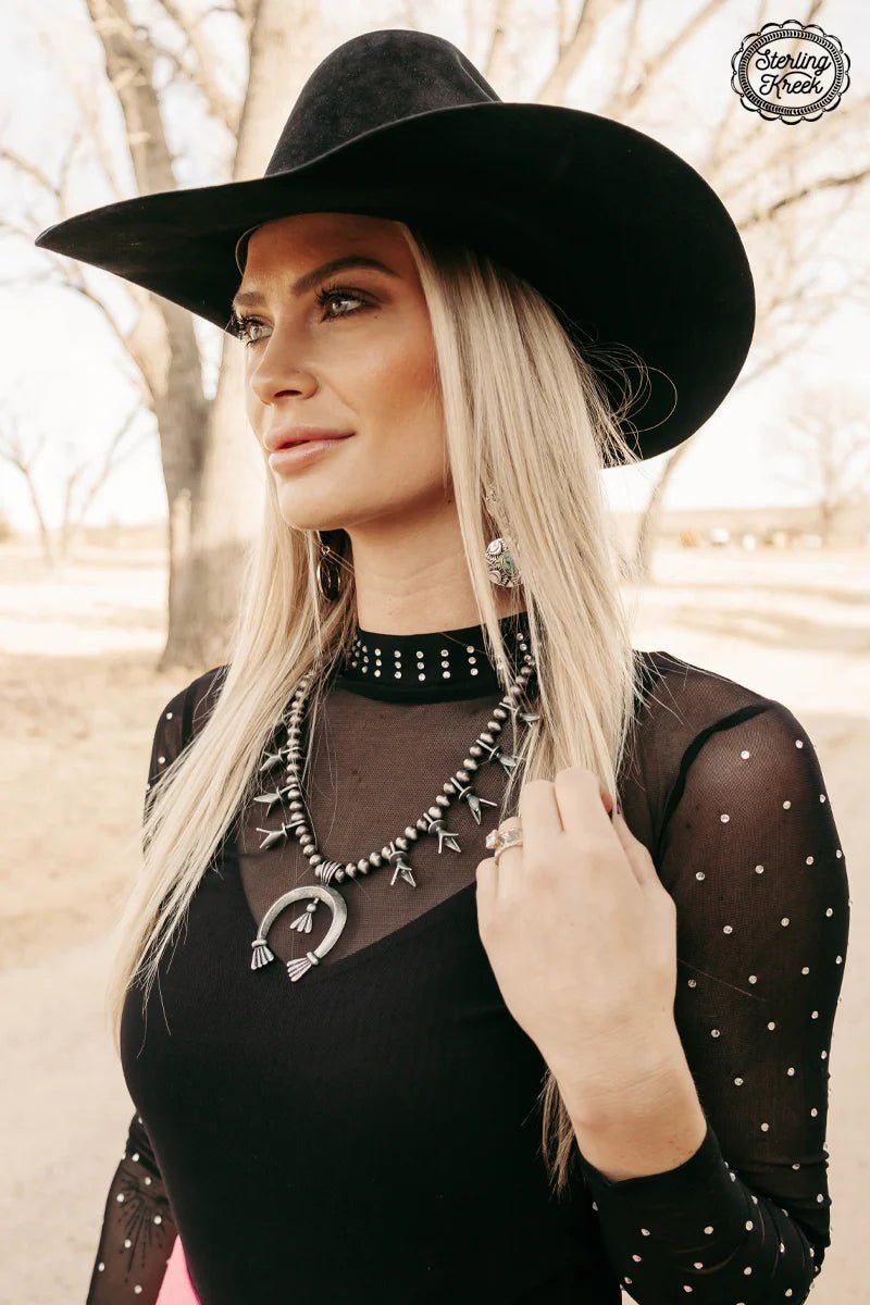 Get ready to wrangle your style with the Tribal Cowgal necklace! Featuring trendy navajo pearls and a lucky silver horseshoe dangle, this unique piece will add a playful touch to any outfit. So saddle up and add a touch of charm to your wardrobe with this must-have accessory. Yee-haw!   Length 13"  3" adjustable chain 