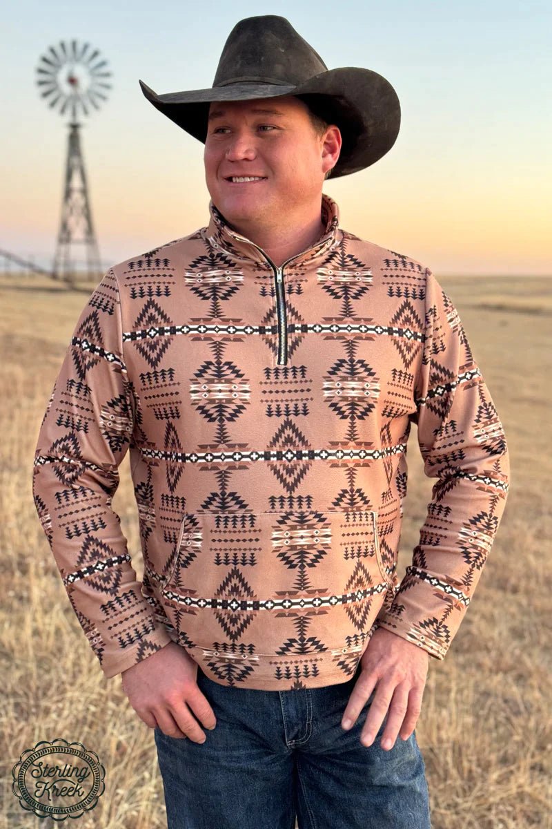 Look your stylish best in the Geronimo Pullover! This classic men's pullover is tan-colored and features a front pocket with an eye-catching Aztec print. Keep cozy while staying chic and go bold with the Geronimo Pullover!  Model is wearing an XL and is 6'2" and is typically an XL closer to the 2x side   mens/unisex  56% Rayon 12% Spandex