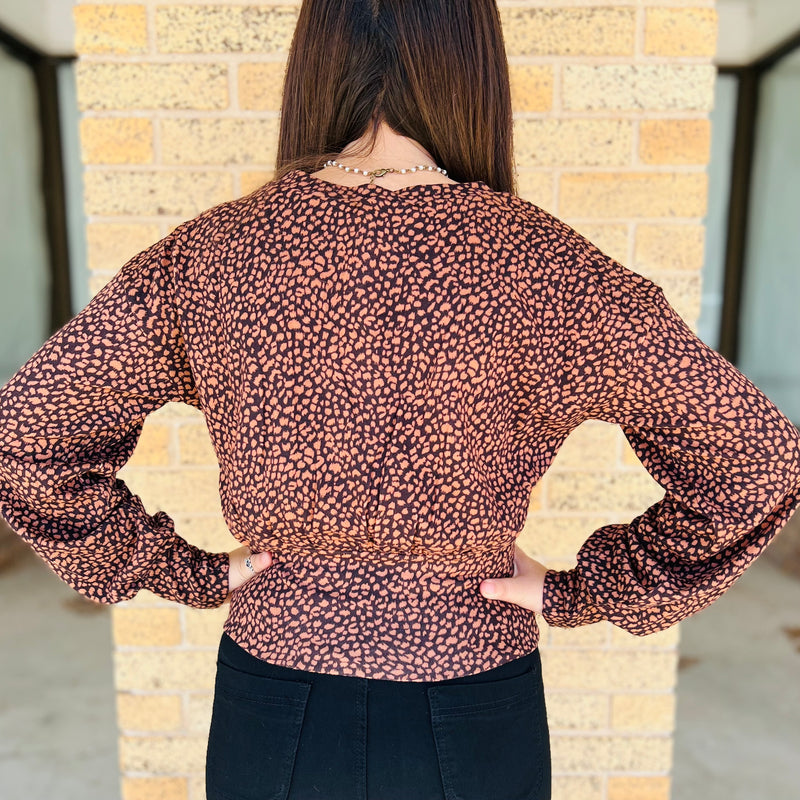 This Rust/Brown V-Neck Dropped Long Sleeve Button Up Brushed Animal Print Top is adorable on and makes any outfit pop. Could be dressed up with a pair of slacks or dressed down with a pair of skinny jeans or leggings.   95% Polyester 5% Spandex  S,M,L
