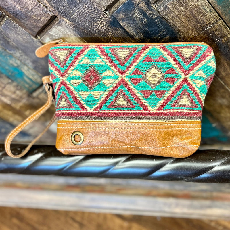 The Caramel Burst Wristlet is Beautiful Burst of Colors. The colors in this Aztec Print are paired perfectly together. The wristlet features a large inside top zipper closure.   ﻿**This Wristlet has the Matching Bag**  7"H X 9"W  12" Removable Wristlet Strap