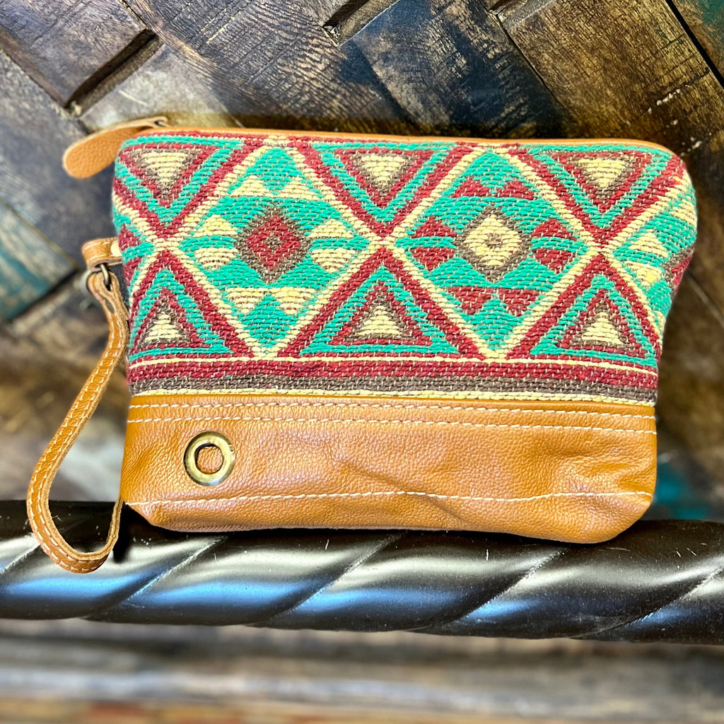 The Caramel Burst Wristlet is Beautiful Burst of Colors. The colors in this Aztec Print are paired perfectly together. The wristlet features a large inside top zipper closure.   ﻿**This Wristlet has the Matching Bag**  7"H X 9"W  12" Removable Wristlet Strap