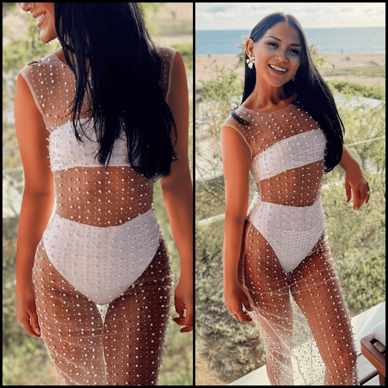 This sultry and unique Pearl Mesh Cover Up is sure to elevate your beachside style. Lightweight and sleeveless, it's constructed with a subtle sheen and see-through mesh, strung together with delicate pearls and silver rhinestones. The midi-length dress oozes elegance in a timeless beige hue – perfect for all your sunny-day shenanigans!