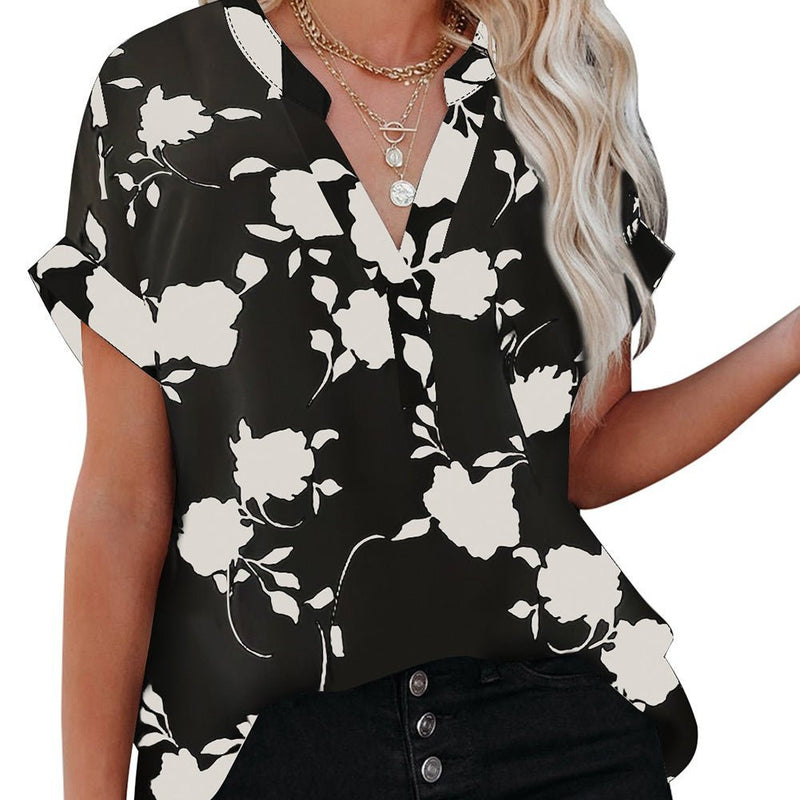 The PLUS Floral Silhouette Top is a White and Black Floral Promenade Printed Short Sleeve Blouse. The V Neck Design with the one button Detail makes this top dressy. The Sleeves are cuffed over and the back is designed to be longer than the front.  XL, 2XL  100% Polyester
