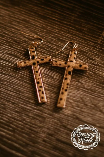 The Spot The Cross Earrings are a gold cross with leopard hard on hide insert. The cross is 1 1/2" W X 2 1/2" L. Light weight and so cute.