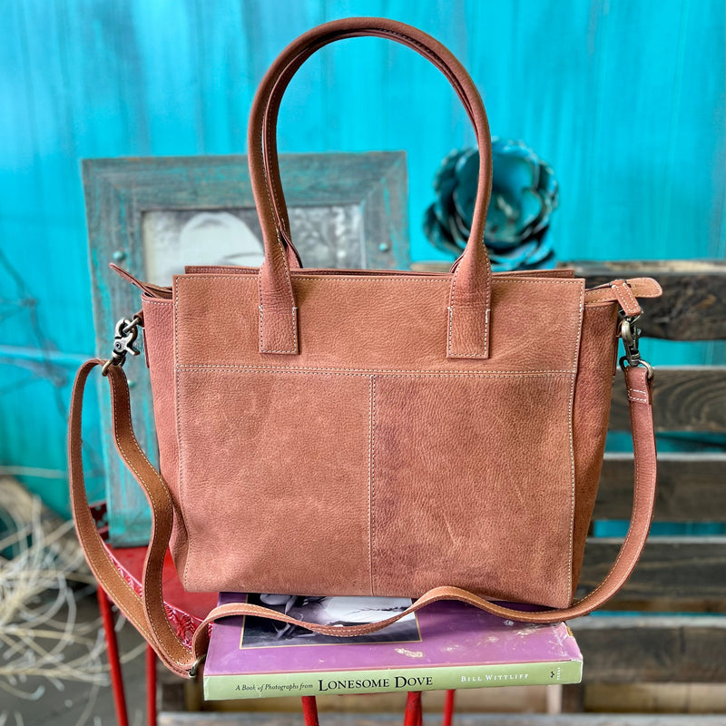 The Casa Grande Large Bag is a Beautiful Soft Leather Hair On Hide Bag that can used as a carry all bag or a laptop carrier. This bag features hand straps to carry or a shoulder strap. The bag has so many pockets and room for multiple uses.  Dimensions 17" W X 13" H  Strap: 44" Adjustable/Removable Strap