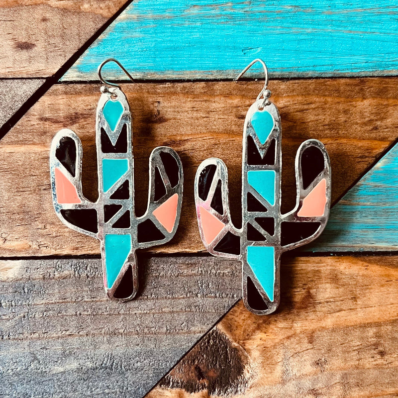 The Mosaic Desert Earrings are an Aztec Print and colorful print silver earrings with fish hook backs. They are a Cactus cutout. They are  2" L X 1 1/4" W  in length. The colors in these earrings make these earrings pop!!