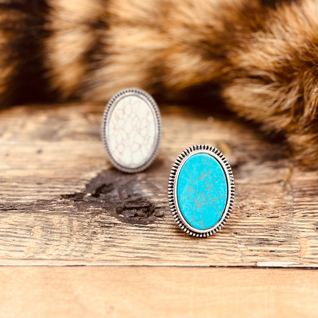 The Smooth Slab Rings are a precious Turquoise or White Slab Stone inlayed in a round silver design. The ring is 1" in Diameter.   It is super light weight and can be adjusted to fit any size finger. Super Cute!! There are 2 different stone variants to choose from.