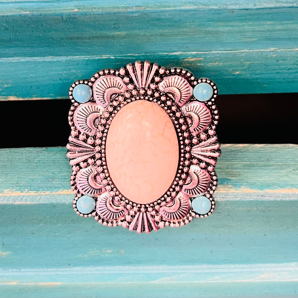 My Ivory Terrain Ring  is a Western Concho Style cuff ring. The ring is 2" in Diameter.   It is super light weight and can be adjusted to fit any size finger. Super Cute!! The beautiful Concho Style with the large ivory stone in the center and the 4 small turquoise stones on each corner.
