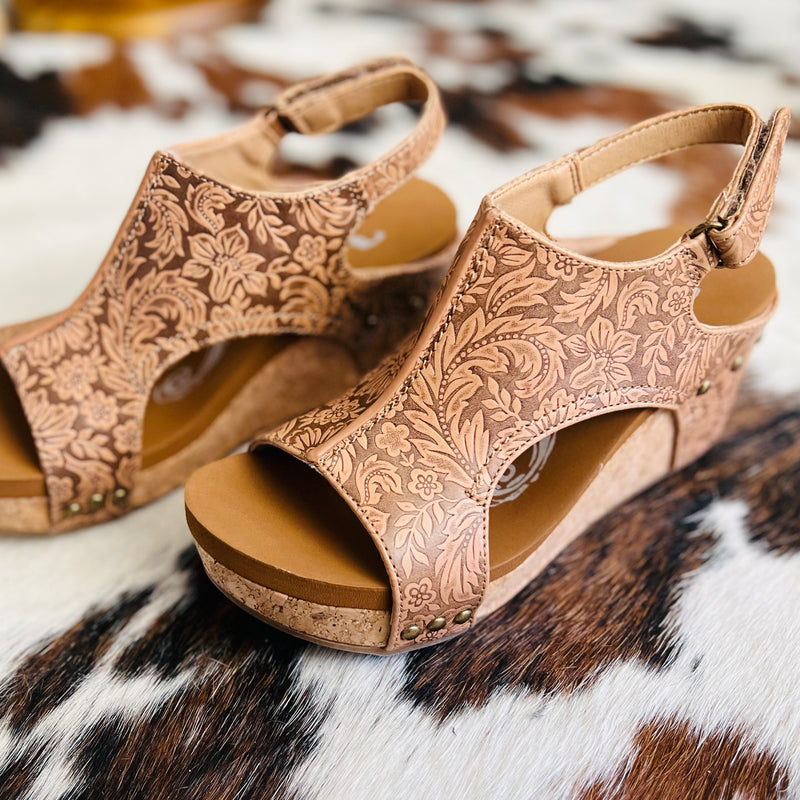 These wedges are perfect for an afternoon in Barcelona or even a barbeque with your friends! The beautiful tooled floral design along with the adjustable strap and nude/brown color can compliment any outfit.   3" heel 