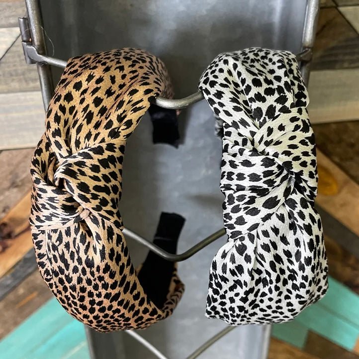 We brought you a knotted headband in two different colors! Snow and Sand! We love animal spots. These are sure to spice up any outfit. These have a silk like fabric and fits most!   Length: 6"  Width: 5"
