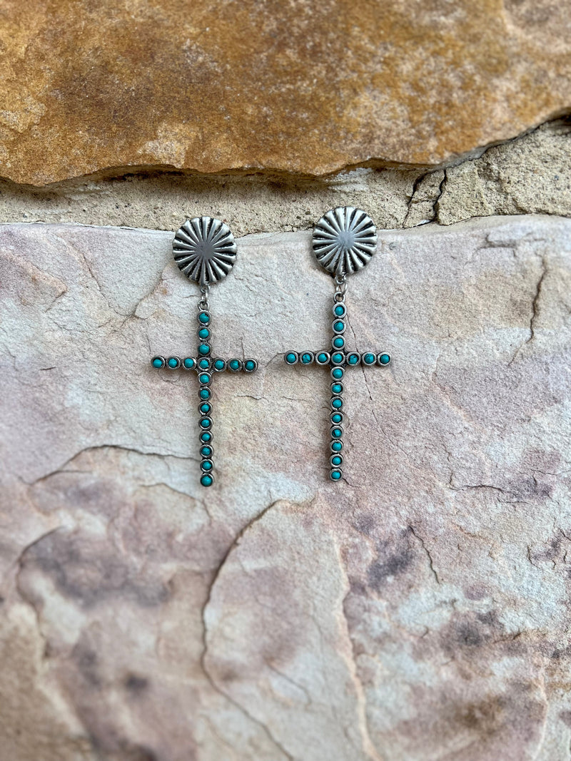 The Faith Over Fear Earrings are a 4" silver dangle cross with multi turquoise stones inlayed,  attached to a 1" round concho with post back.  Cross size is: 1 1/2" W X 2 3/4"L, attached to concho with dangle is 4" in total length. 