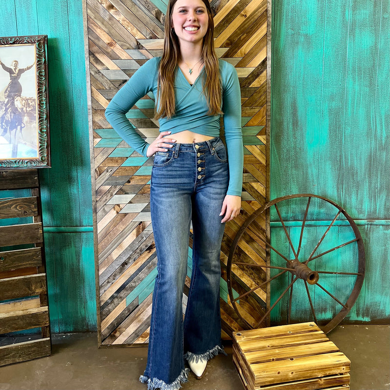 The Flare in Her Eyes Jeans are a  5 Button Down Wide Flare Jeans. The jeans are true to size and very figure flattering. Model is wearing a size 3; waist: 25", hip: 32 1/2", front rise: 10 1/2", leg opening: 17 3/4", inseam:24".  69.5% Cotton, 27%Polyester, 3.5%Spandex