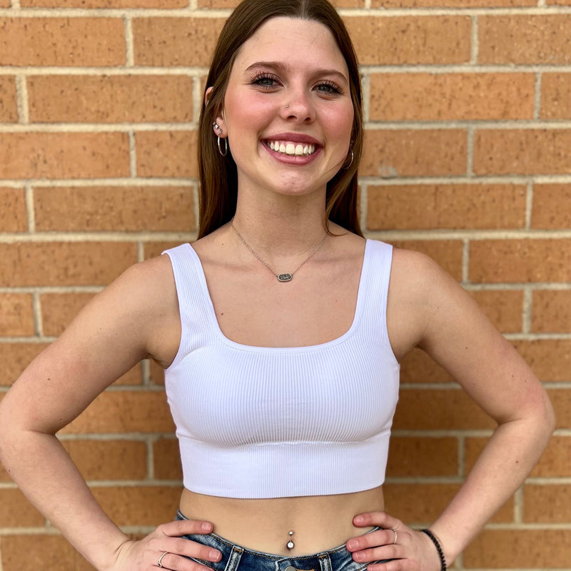 Our Talk Of The Town Tank Top is the perfect staple piece for your wardrobe. With a ribbed texture and a square neck, it’ll pair perfectly with all your favorite bottoms. Plus, the built-in bralette gives you the extra coverage you need and comes in multiple colors to match your unique style. Ready to take on the town?  90% Nylon, 10% Spandex  **S/M & L/XL sizes available**