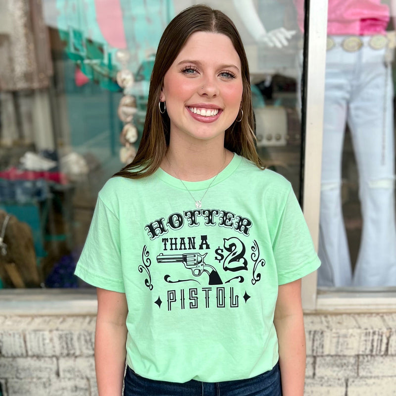 Our PLUS Size Hotter Than A $2 Pistol Tee is perfect for any occasion. Made from 50% Cotton & 50% Polyester, this loose fitting, short sleeve tee features a vibrant lime green base and black text. Perfect for everyday wear and guaranteed to make a statement.