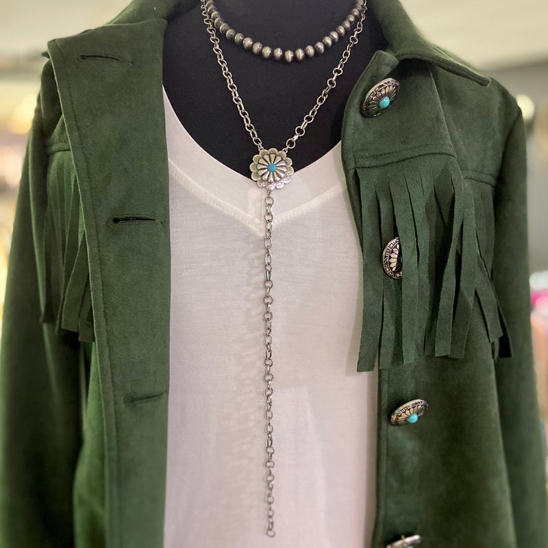 Eve's Addiction Layered Necklace is a 2 layered strand. One is a 8" faux buffalo pearl strand and the other is a 10" silver chain with a silver concho with a turquoise stone and then another 10" single chain dangling. This necklace is adjustable and can be worn with so many outfits. 