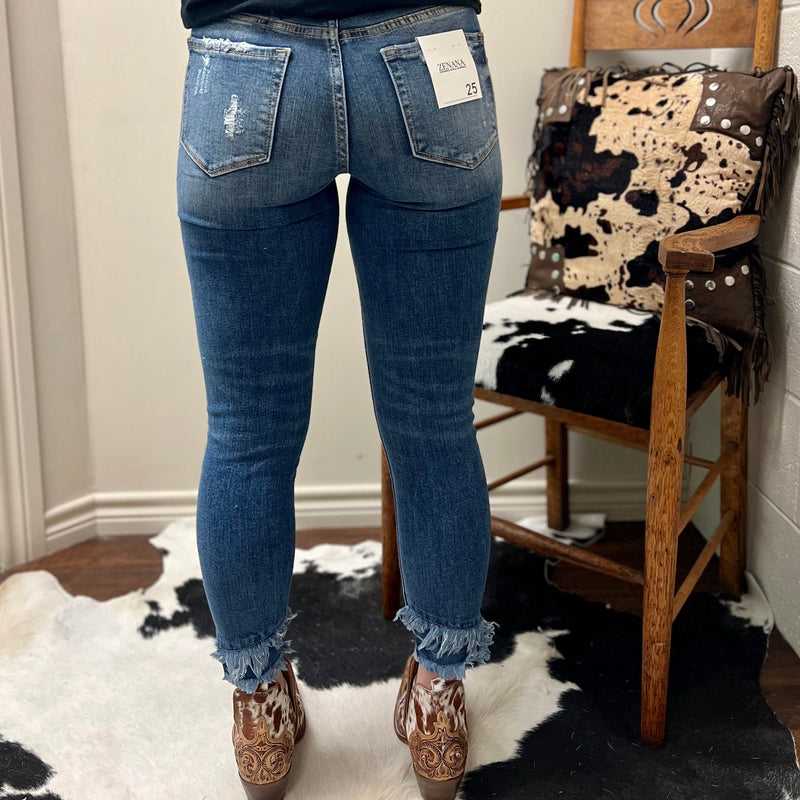 These Gots To Have Double Frayed Hem Jeans feature a mid-rise waist and distressed cropped silhouette with double frayed hem, crafted in a skinny and stretch fit. With a rise of 9 1/4" and inseam 26” these versatile jeans are perfect for any occasion.