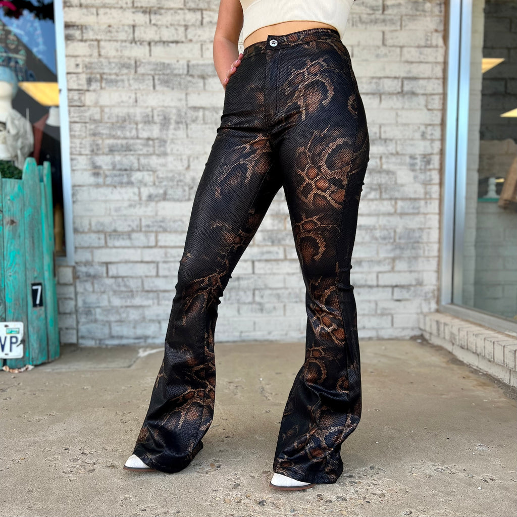 Our Sassy Snake Print Flares are perfect for any concert look. With 11" high rise and 33" inseam, they offer a comfortable fit while providing a figure-hugging silhouette. Made with very stretchy, textured fabric, they combine style and convenience.