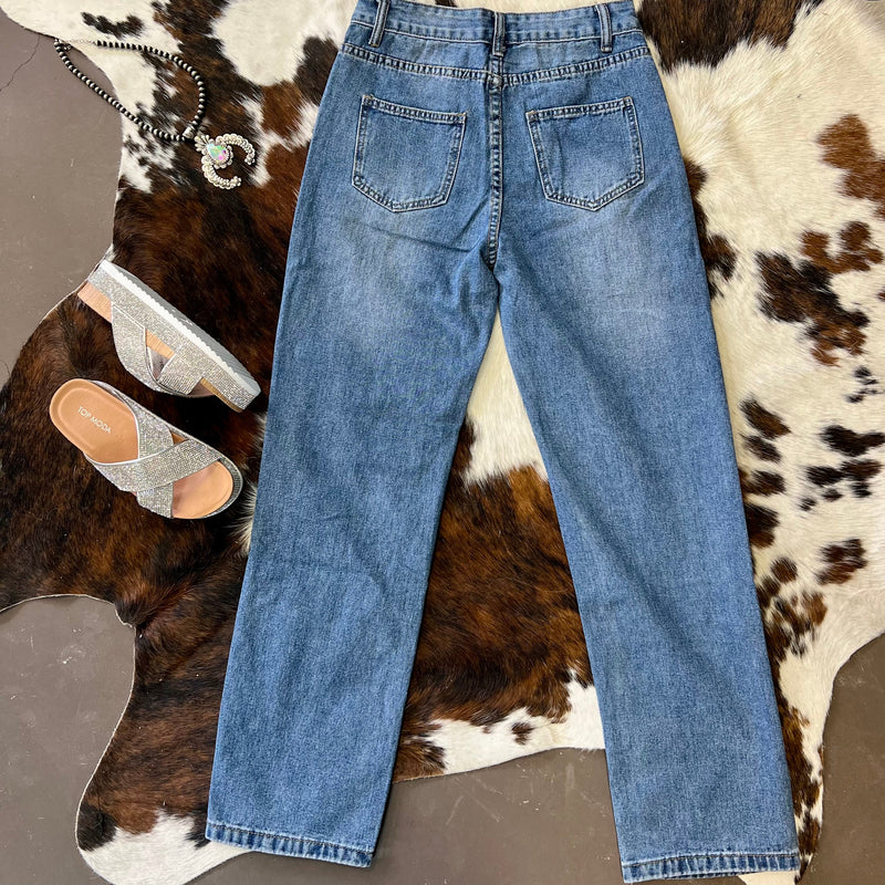Rhinestone medium wash jeans. Rhinestone distressed straight leg jeans. Ripped straight leg jeans. Women's trending jeans. Western boutique. Online boutique. Small business. Women's western wear. 