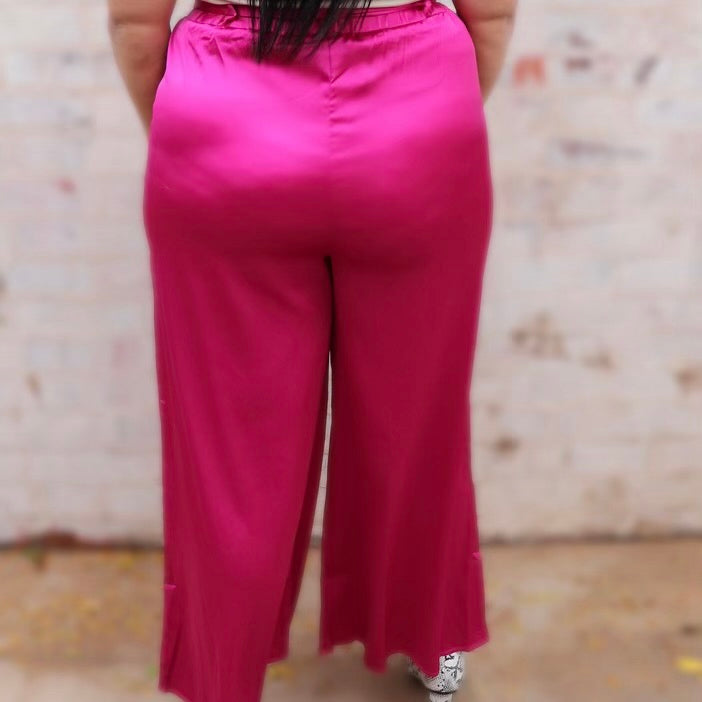 Step up your fashion game with our Plus Pink Queen Pants! The perfect pink satin piece for a plus size curvy queen, these wide leg trousers will keep you looking stylish and trendy so you can stay ahead of the fashion curve. Ready to be queen of the scene? Get into these pants!   95% POLYESTER   5% SPANDEX