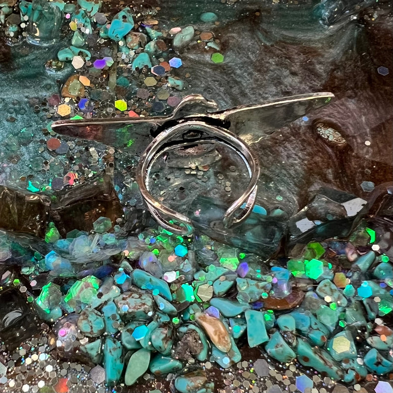 The Thunderbird Ring is a high polish western concho style arrow aztec textured thunderbird casting flexible cuff ring.
