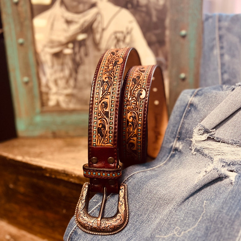 The Rich Darling Tooled Belt is a Beautiful Floral Tooled Design with turquoise painted detail that looks like small turquoise stones. The Leather Tooled Design is Absolutely Gorgeous. This is one you will want to add to your collection and will sell out FAST!!!  S-32"  M-36"  L-40"  XL-44"