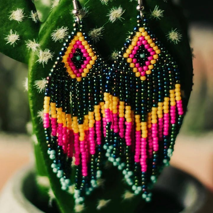 The Native Dreams Seed Beed Earrings are a multi bead, multi colored, tribal design. The colors are bright and truly stand out. They measure 1 1/2' W X 3 1/4" L. They are light weight and would add tons of color to any outfit. 