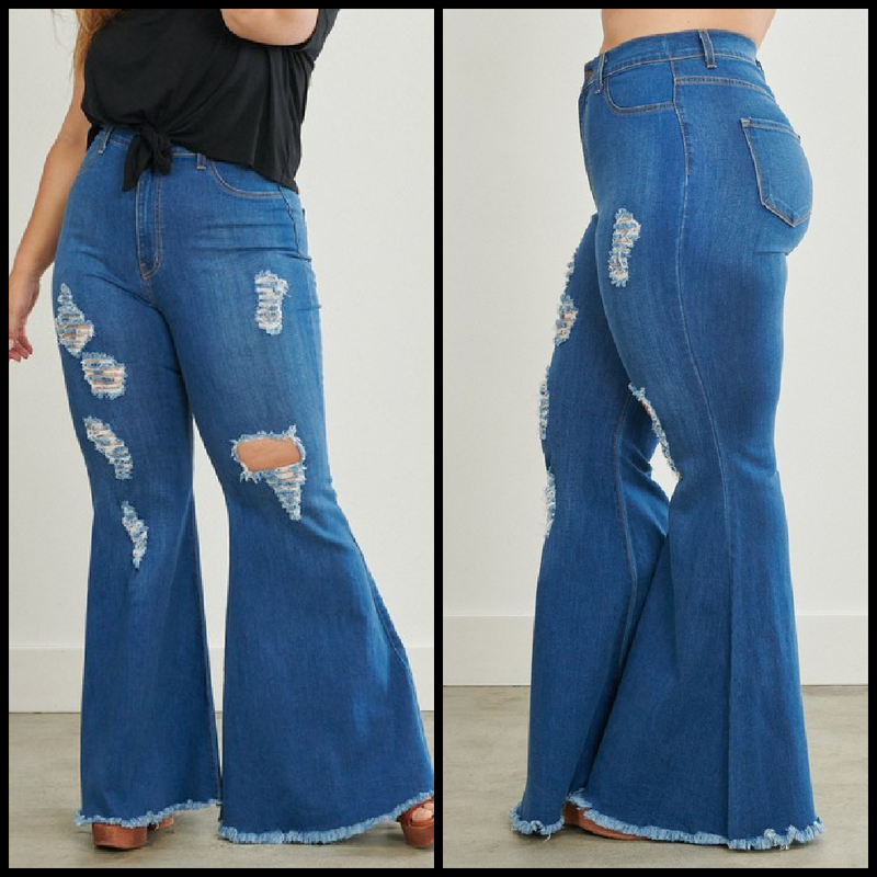 Super high waisted medium wash flare jeans with rips and raw frayed hems.  73% cotton, 14% Rayon, 11% polyester, 2% spandex  Inseam: 32"  Rise: 14"