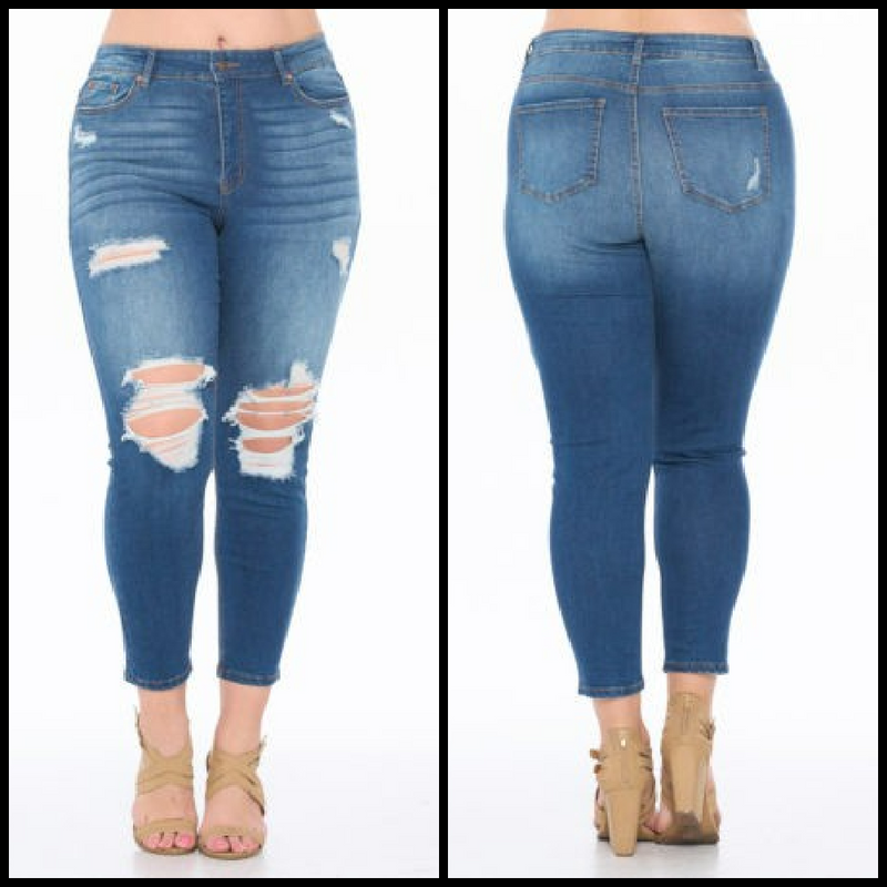 Plus size medium wash ripped  high rise skinny jeans in ankle length. 